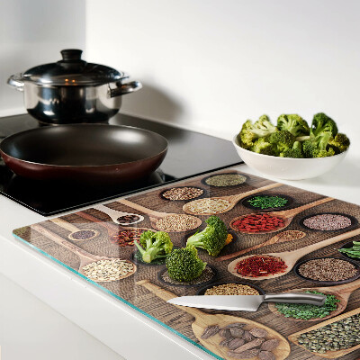 Glass cutting board Spices and herbs in spoons