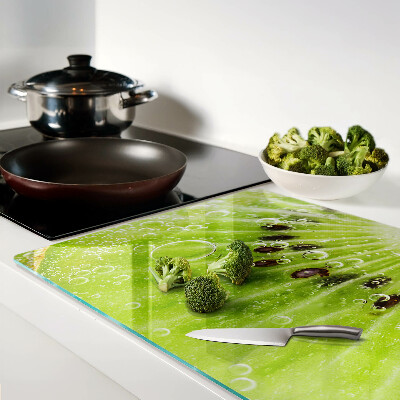 Chopping board glass Kiwi with drops of water