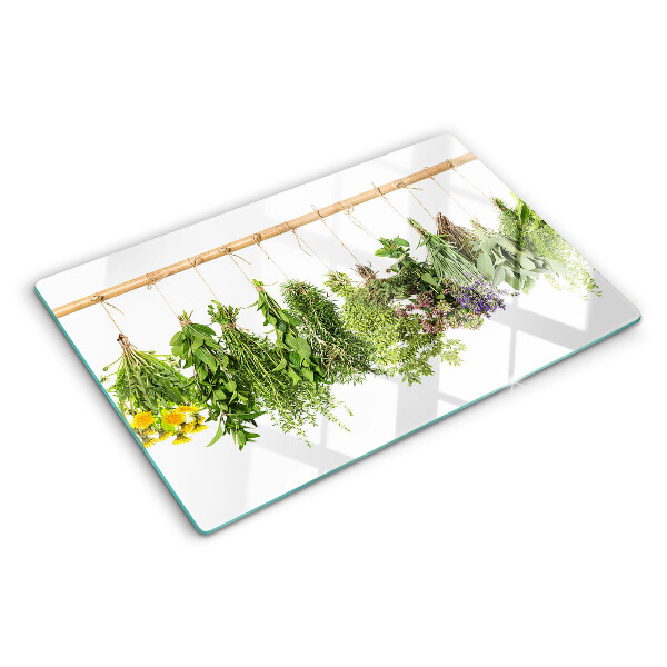 Glass kitchen board Dried herbs on a string