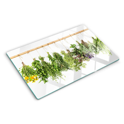 Glass kitchen board Dried herbs on a string