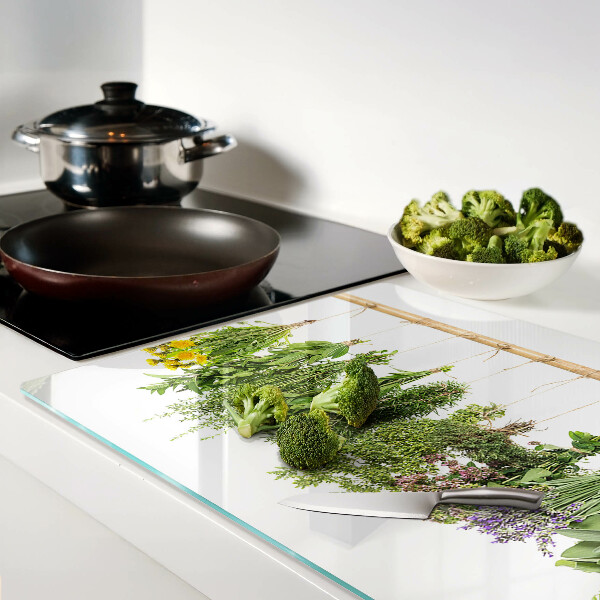 Glass kitchen board Dried herbs on a string