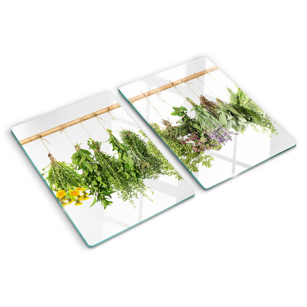 Glass kitchen board Dried herbs on a string