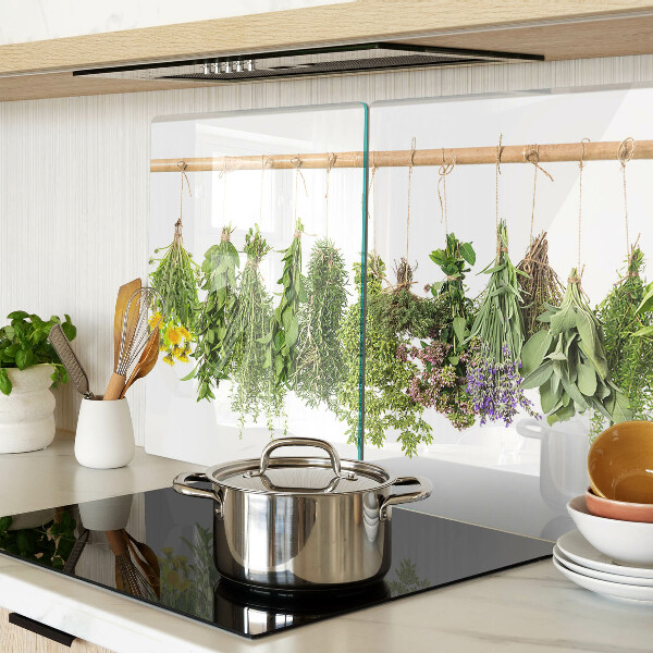 Glass kitchen board Dried herbs on a string