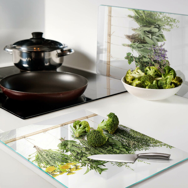 Glass kitchen board Dried herbs on a string
