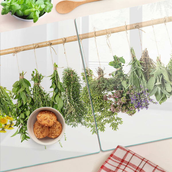 Glass kitchen board Dried herbs on a string