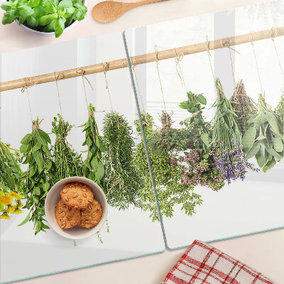 Glass kitchen board Dried herbs on a string