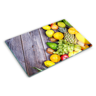 Cutting board Fruits on a wooden background