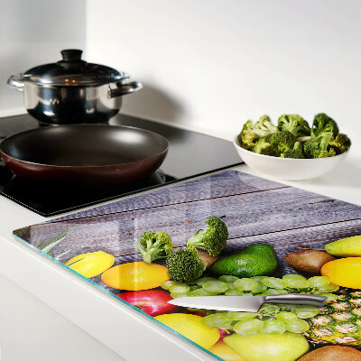 Cutting board Fruits on a wooden background
