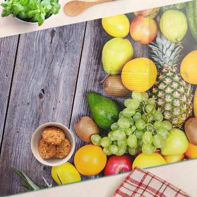 Cutting board Fruits on a wooden background