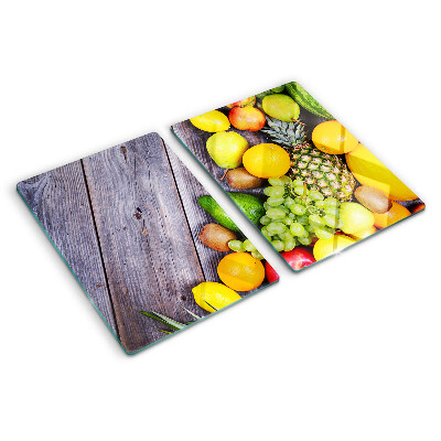 Cutting board Fruits on a wooden background