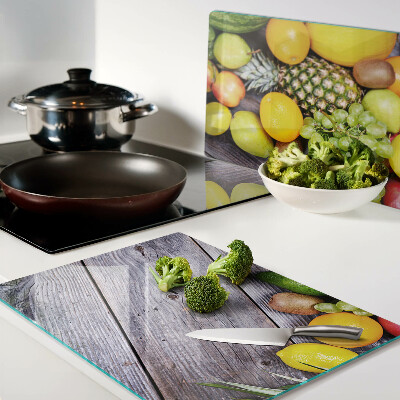 Cutting board Fruits on a wooden background