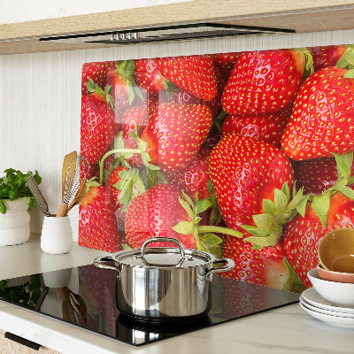 Glass chopping board Strawberries on the background