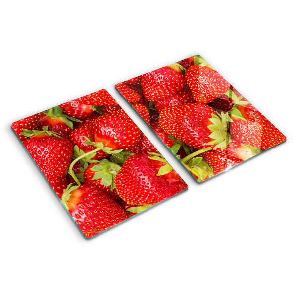 Glass chopping board Strawberries on the background