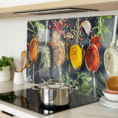 Glass cutting board Spices in spoons