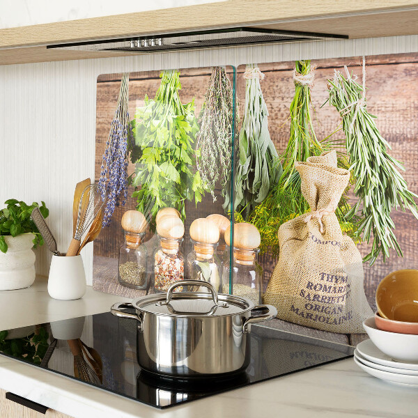 Chopping board glass Herbs and spices on a wood background