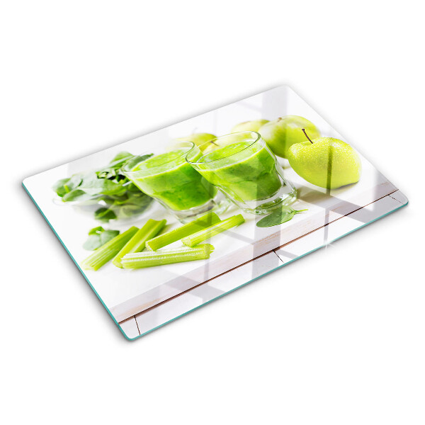 Glass chopping board Green smoothie with fresh ingredients