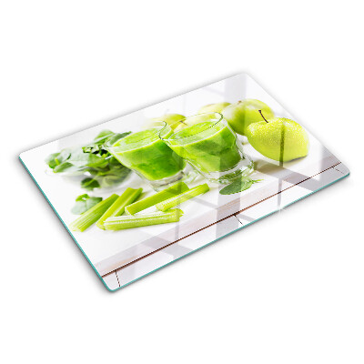 Glass chopping board Green smoothie with fresh ingredients