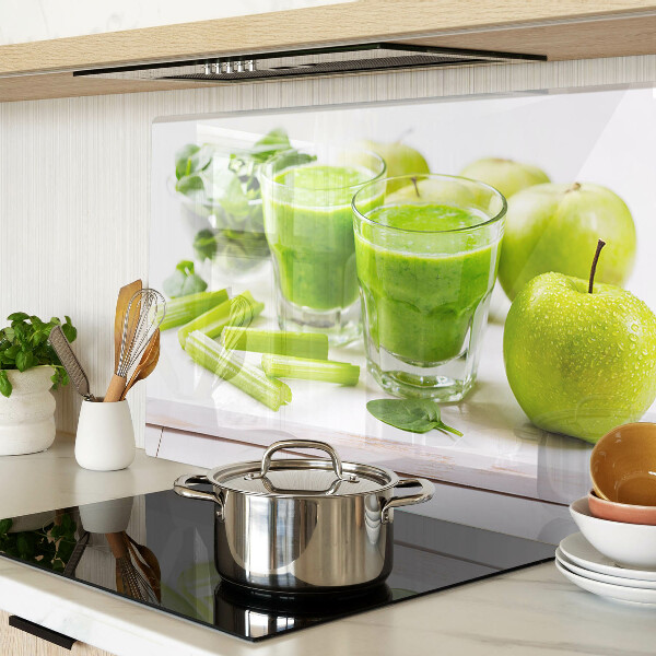 Glass chopping board Green smoothie with fresh ingredients