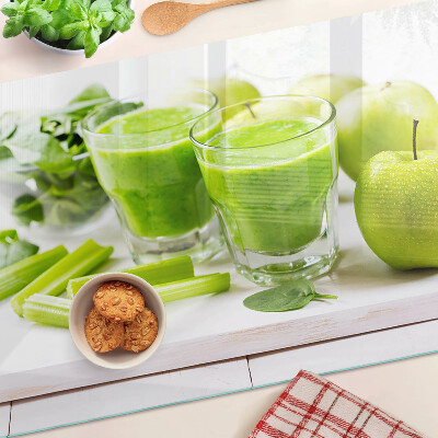 Glass chopping board Green smoothie with fresh ingredients