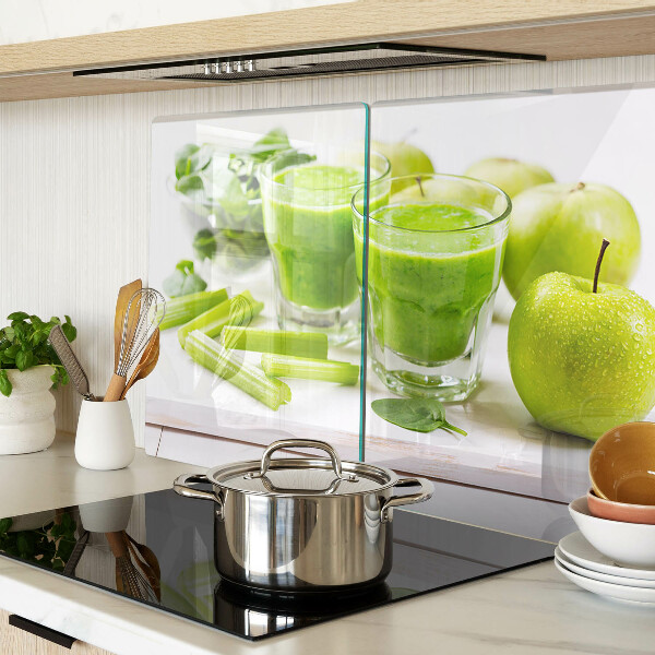 Glass chopping board Green smoothie with fresh ingredients