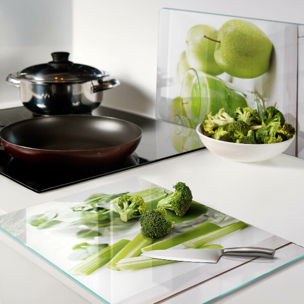 Glass chopping board Green smoothie with fresh ingredients