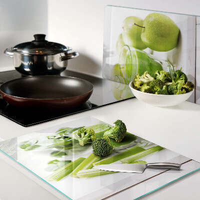 Glass chopping board Green smoothie with fresh ingredients