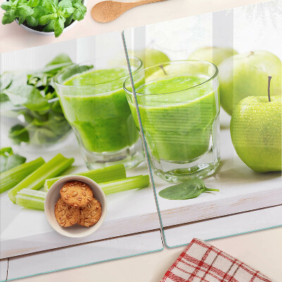 Glass chopping board Green smoothie with fresh ingredients