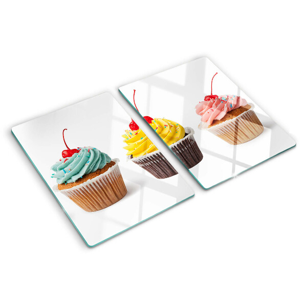 Chopping board glass Cupcake with whipped cream and cherry