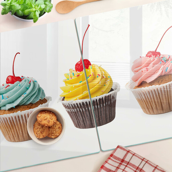 Chopping board glass Cupcake with whipped cream and cherry