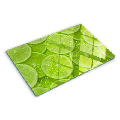 Cutting board Lime slices on a green background