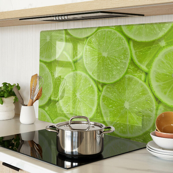 Cutting board Lime slices on a green background