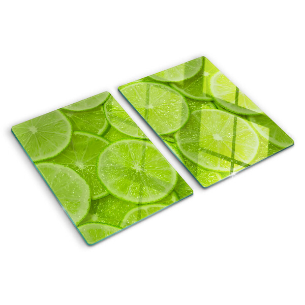Cutting board Lime slices on a green background