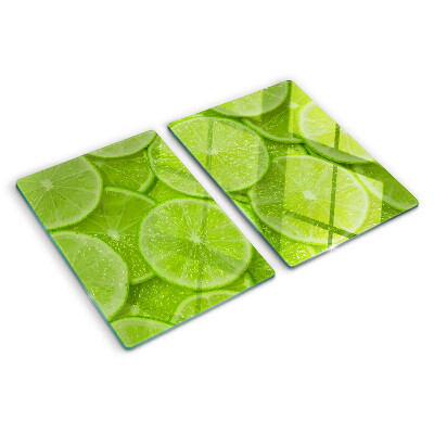 Cutting board Lime slices on a green background