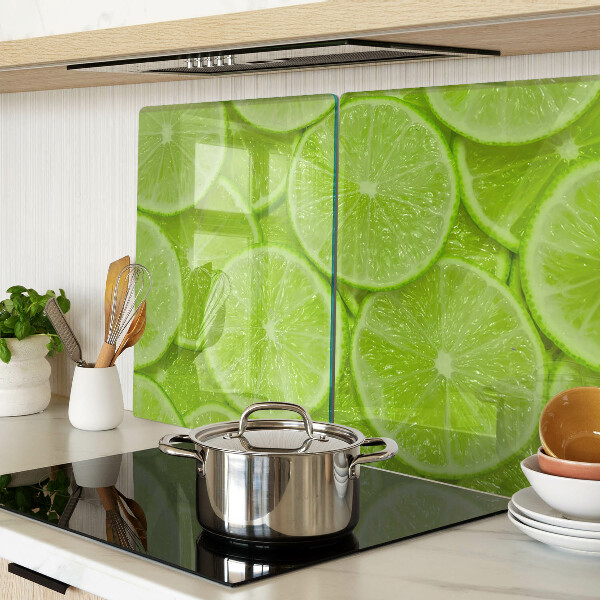 Cutting board Lime slices on a green background