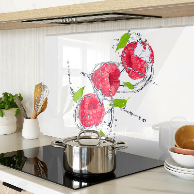 Chopping board glass Raspberries in water with leaves