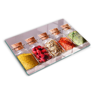 Glass chopping board Spices in glass jars