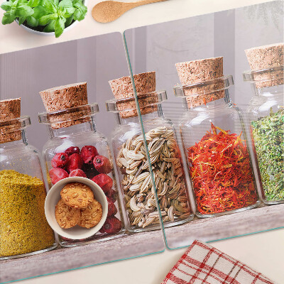 Glass chopping board Spices in glass jars
