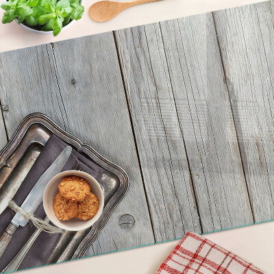 Chopping board glass Rustic cutlery on a wooden background