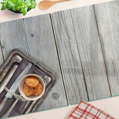 Chopping board glass Rustic cutlery on a wooden background