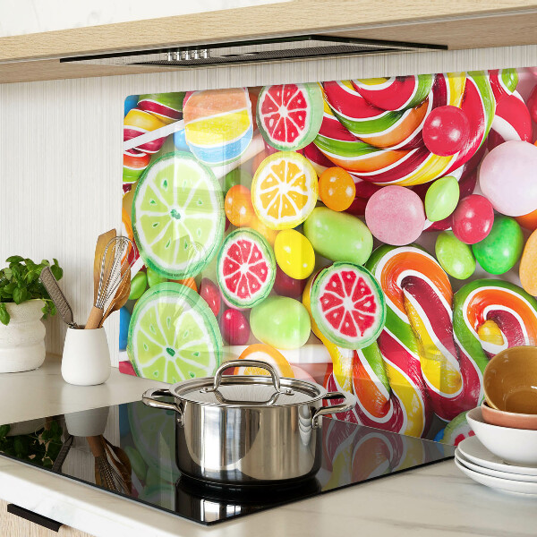 Glass cutting board Sweet candies and fruits