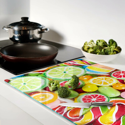 Glass cutting board Sweet candies and fruits