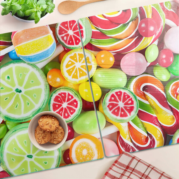Glass cutting board Sweet candies and fruits
