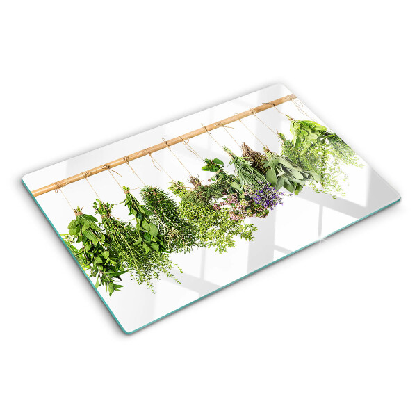 Glass chopping board Dried herbs on a string