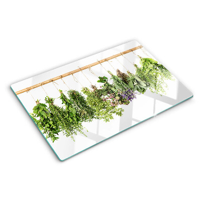 Glass chopping board Dried herbs on a string