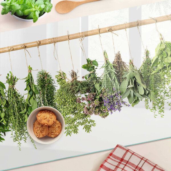Glass chopping board Dried herbs on a string