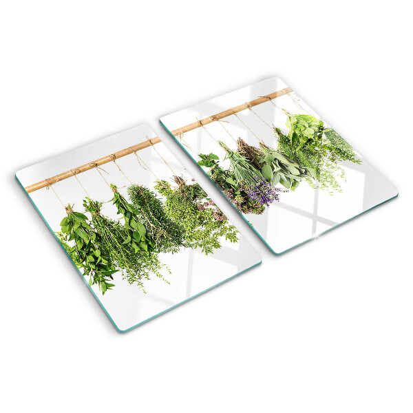 Glass chopping board Dried herbs on a string