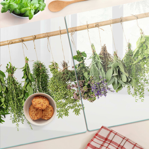 Glass chopping board Dried herbs on a string