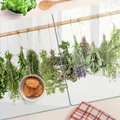 Glass chopping board Dried herbs on a string