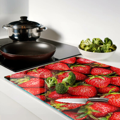 Cutting board Strawberries on a red background