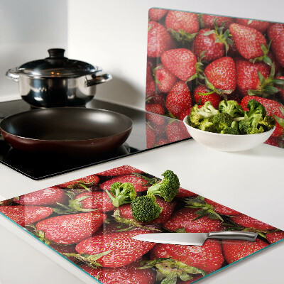 Cutting board Strawberries on a red background